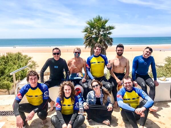 Calvin and group of people surfing.